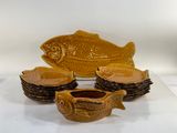 several pieces of pottery sitting on top of each other on a table