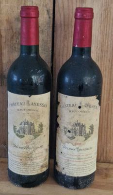 two bottles of wine sitting on a wooden shelf next to each other