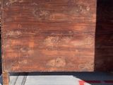 a large piece of wood sitting on the back of a truck