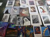 many pictures of people on a table with a lot of them