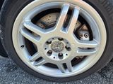 the tire of a car with a flat tire on the road