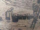 a vase with a drawing of a man and a woman on the beach