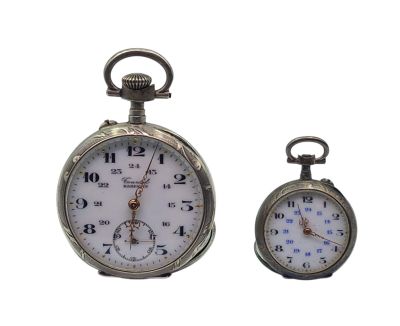 two clocks sitting side by side on a white background