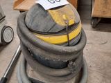 an image of a pile of vacuums in a warehouse