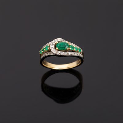an emerald and diamond ring