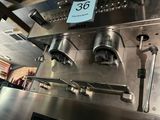 a close up of a machine with a price tag on it