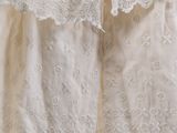 an image of a white dress hanging on a clothes line