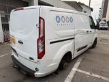 a white van that is parked in a parking lot