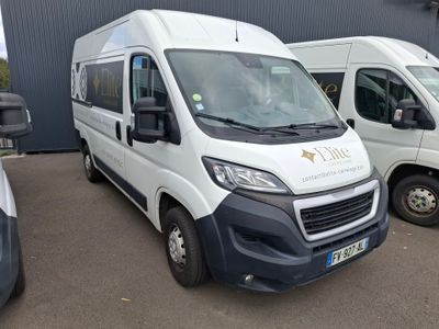 three white vans parked in a parking lot next to each other