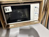 a microwave that is sitting on top of a table