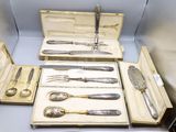 a lot of silverware in a box on a table