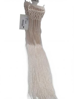 a close up of a long white hair with a tag on it