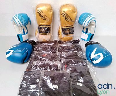 a bag of boxing gloves and a pair of gloves on a table