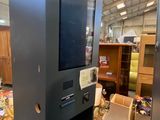 a machine that is sitting inside of a building