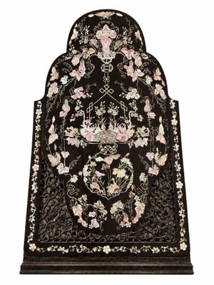 a black and white oriental rug with flowers on it