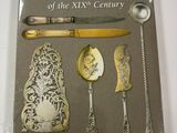 a book with a knife, spoon, and other silverware on it