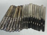 a lot of knives that are sitting on a table
