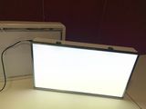 a light that is sitting on a table next to a box