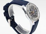 an image of a watch with a blue strap on a white surface