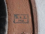 a close up of a shoe with a brown sole