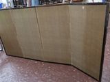 a room divider in the middle of a room with chairs and tables