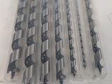 five different sizes of drill bits in a plastic bag
