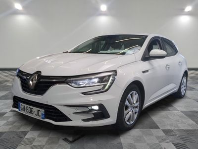 the white car is parked on a checkered floor in a room