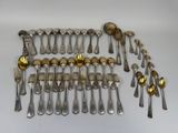 a lot of spoons and spoons that are on the table