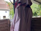 a pink cloth draped over the back of a truck