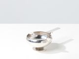 a spoon with a spoon rest on it on a table