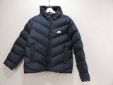 the jacket is hanging on a hanger on the wall
