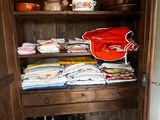 a wooden cabinet with a lot of items on it
