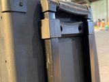 a piece of luggage that is sitting in a warehouse