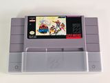 an old nintendo game is sitting on top of a white table