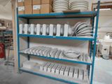 many plates and pans on the shelves in the warehouse