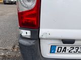 a white van that is parked in a parking lot
