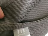 a person holding a piece of luggage with a tag on it