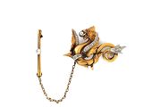 a close up of a brooch with a chain attached to it