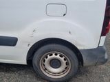 a white van that is parked on the side of the road