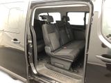 the interior of a van with the door open and the passenger seat down