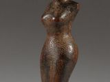 an image of a statue of a woman with a hat on her head