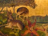 un tableau représentant un cerf et un autre cerf dans les bois