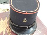 a hat on top of a book on a table