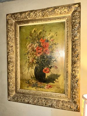 a painting of flowers in a vase on the wall