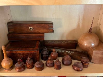 a shelf that has many wooden objects on it