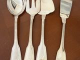four forks and spoons sitting on a wooden table