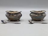 pair of antique silverplated sugar and creamers with spoons