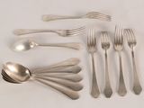 a lot of silver spoons and forks on the table