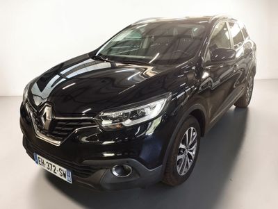 a black car is parked in a white room