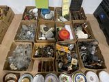 boxes of assorted items are sitting on the floor next to a laptop